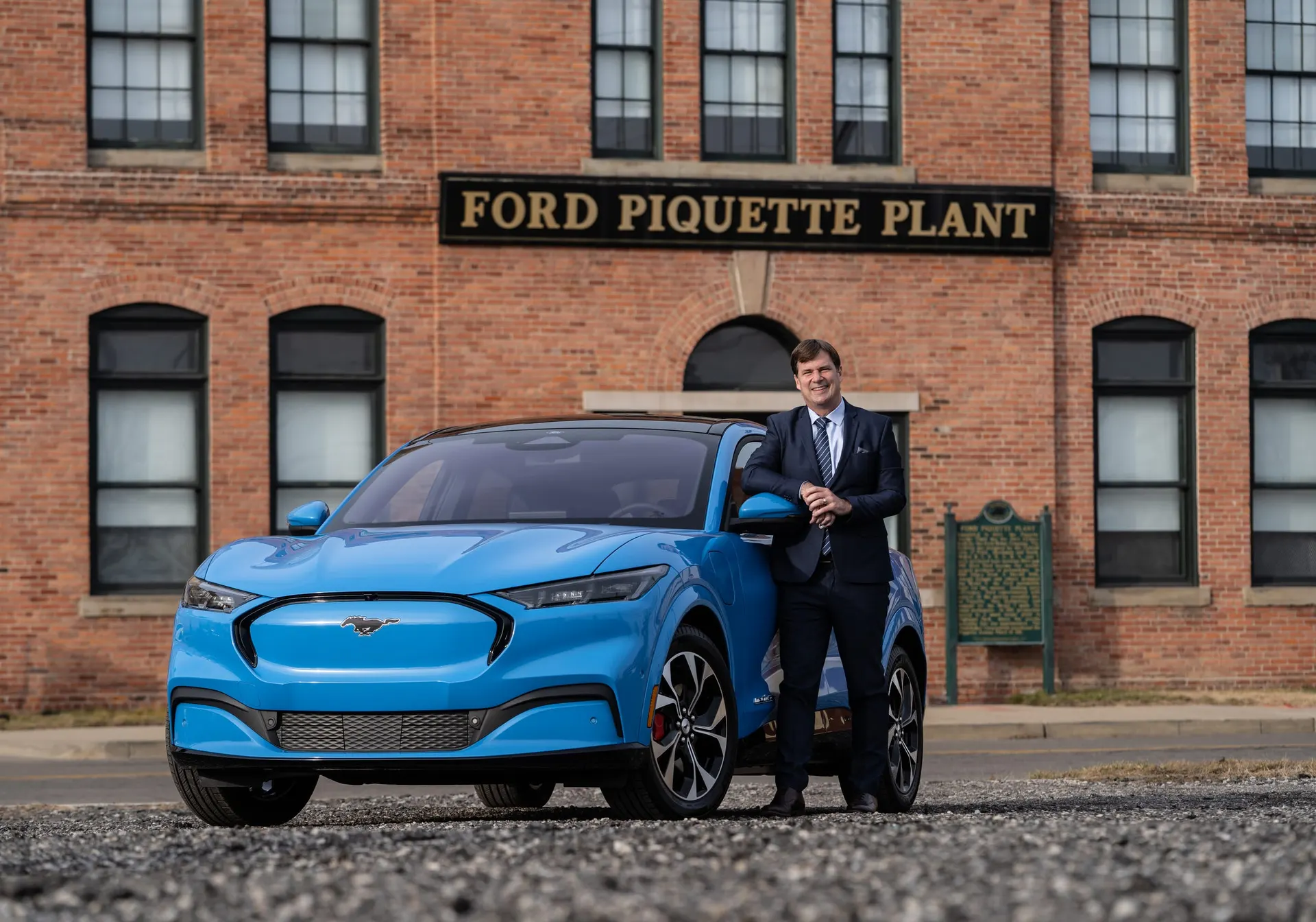 Ford Motor Co. CEO Jim Farley stands in January with a 2021 Mustang Mach-E 4X model outside of the Ford Piquette Avenue Plant in Detroit.